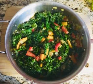 Kale added to Sauteed Peppers, Garlic, Onion in Pan