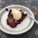 Easy Raspberry and Blueberry Cobbler on plate with ice cream