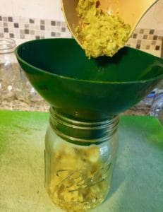 pour dill relish into canning jars